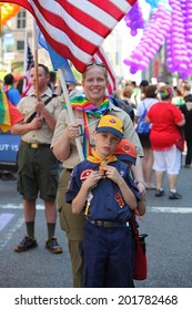 NEW YORK CITY - JUNE 29 2014: Heritage Of Pride Sponsored The Nation's Largest Gay Pride Parade In Manhattan That Stretched Along Fifth Avenue To Christopher Street. Cub Scout With Troop Leader Mom