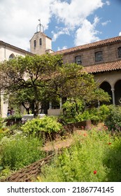 New York City, New York - June 29, 2019:  View of the Met Cloisters in Washington Height Manhattan with architectural details and people visiting in sight. 