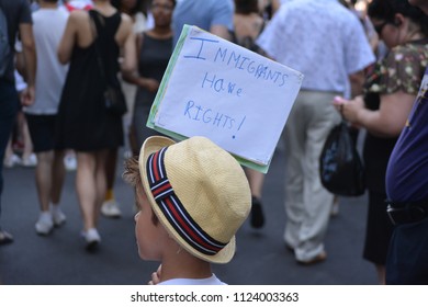 New York City, June 30, 2018 - Child holds a sign while participating in the Families Belong Together March for immigrants in Lower Manhattan.