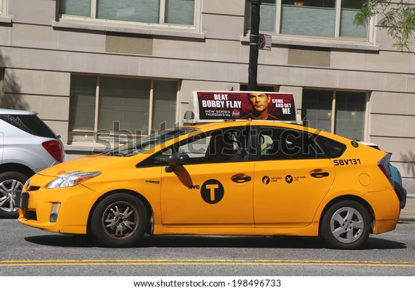 NEW YORK CITY - JUNE 5: New York City Taxi on\
June 5, 2014. New York City has around 6,000 hybrid taxis,\
representing almost 45 of the taxis in service, the most in any\
city in North America