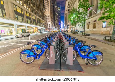 NEW YORK CITY - JUNE 8, 2013: NYC Bike Share System Along City Streets At Night, Manhattan, New York City, USA