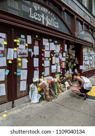 New York City, June 9 2018 - Woman taking pictures of a memorial outside of Les Halles honoring the late chef, television personality and writer Anthony Bourdain in Manhattan. 