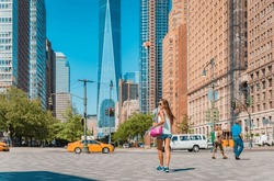 New York City Life. Woman Walking By View Of Manhattan Skyline American People Walking Enjoying Manhattan On Perfect Summer Day. NYC Cityscape