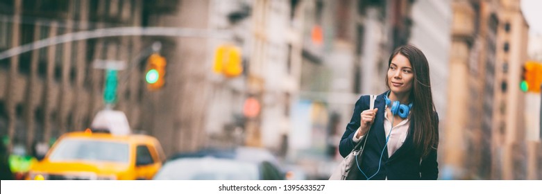 New York City Lifestyle Young Asian Woman Walking Commute In NYC Street. Urban People Hipster Girl In Traffic Banner Panorama. Chinese Lady Looking To Side With Purse And Headphones For Commute.