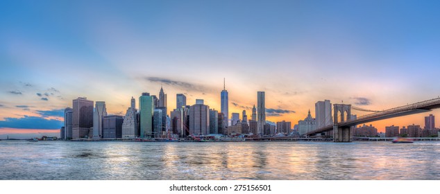 New York City Manhattan Downtown Skyline And Brooklyn Bridge.