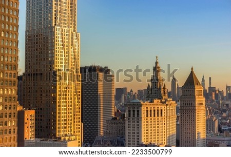New York City. Manhattan downtown skyline skyscrapers at sunset. Golden Hour.