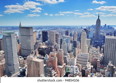 New York City Manhattan midtown aerial panorama view with skyscrapers and blue sky in the day. - Powered by Shutterstock