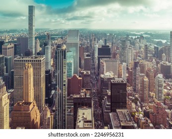 New York City Manhattan panorama with skyscrapers next to Central Park and busy street. Aerial high angle view - Shutterstock ID 2246956231