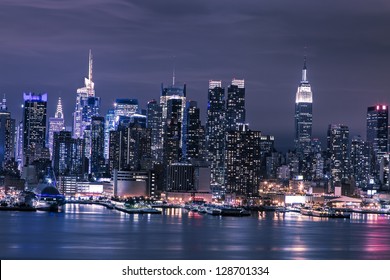 New York City Manhattan Skyline Panorama At Night Over Hudson River