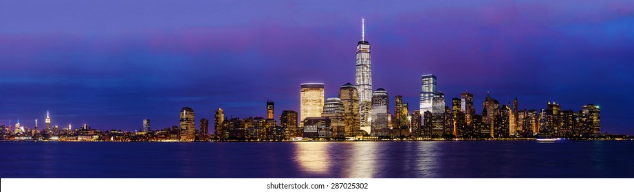 New York City Manhattan skyline panoramic image over Hudson River viewed from New Jersey at sunset.