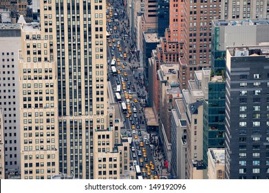 New York City Manhattan Street Aerial View With Skyscrapers, Pedestrian And Busy Traffic.