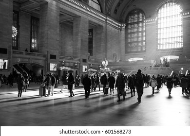 New York City, New York  March 13, 2017: Rays Of Sunlight Inside Of Grand Central Station With People Walking In The Rush Time