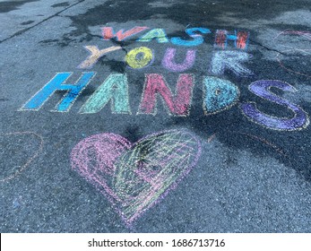 NEW YORK CITY - March 27, 2020: Coronavirus Covid-19 Quarantine Shelter In Place In Upper West Side Manhattan Has Left Empty Spaces Like No People. Chalk Says Wash Your Hands Disinfect Germs