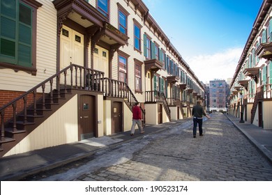 NEW YORK CITY - MARCH 8, 2014:  Row houses along historic Sylvan Terrace in Manhattan.  This landmark cobblestone street is in the Washington Heights section of NYC