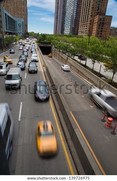 NEW YORK CITY - MAY 16: View downtown towards\
Brooklyn Battery Tunnel on West Street NYC on May 16, 2013. This\
tunnel opened in 1950 is longest continuous underwater vehicular\
tunnel in North America