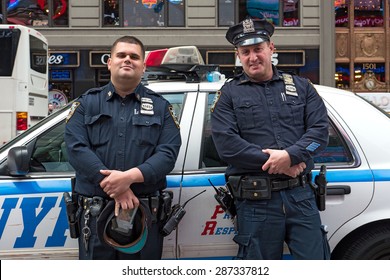 NEW YORK CITY - MAY 2015: NYPD Police Officers At Times Square. The New York City Police Department, Established In 1845, Is The Largest Municipal Police Force In The United States. 