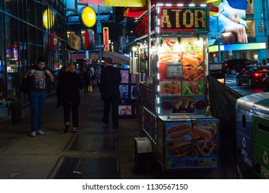 New York City - May 2018: People Buying Food From A Late Night Food Vendor Near Times Square, NYC.