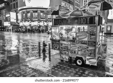 NEW YORK CITY - MAY 21: A Hot Dog Stand Vendor Stays Open Late Into The Night To Sell A Few More Hot Dogs To Late Night Tourists, May 21, 2013 In NYC.