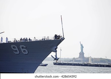 NEW YORK CITY - MAY 25 2016: Ships Of The US Navy Docked In The Brooklyn Ferry Terminal As The 28th Annual Fleet Week Started. USS Bainbridge, DDG-96, Arrives In NY Harbor Passing Statue Of Liberty