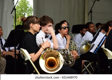 NEW YORK CITY - MAY 30 2016: Green-Wood Cemetery staged it's 28th annual Memorial Day concert by the Symphonic Orchestra at 3rd Street. Horn section awaits cue