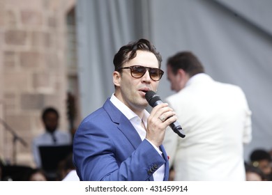 NEW YORK CITY - MAY 30 2016: Green-Wood Cemetery staged it's 28th annual Memorial Day concert by the Symphonic Orchestra at 3rd Street. Broadway star Ryan Silverman sings Bernstein