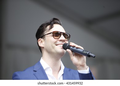 NEW YORK CITY - MAY 30 2016: Green-Wood Cemetery staged it's 28th annual Memorial Day concert by the Symphonic Orchestra at 3rd Street. Broadway singer Ryan Silverman sings Leonard Bernstein