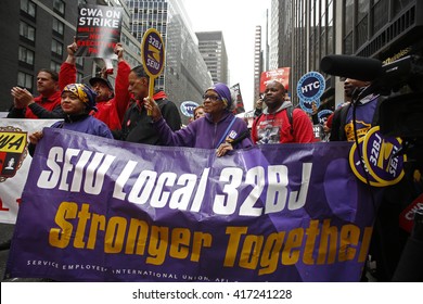 NEW YORK CITY - MAY 5 2016: Striking Verizon workers gathered with members of other unions & labor leaders in front of Verizon's Wall St headquarters