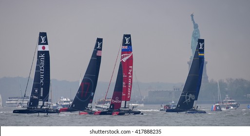 NEW YORK CITY - MAY 7 2016: The 35th Annual America's Cup Yacht Race Was Held In New York Harbor As Six Contenders Vied In Uneven Weather. Four Sails In NY Harbor With Statue Of Liberty Background