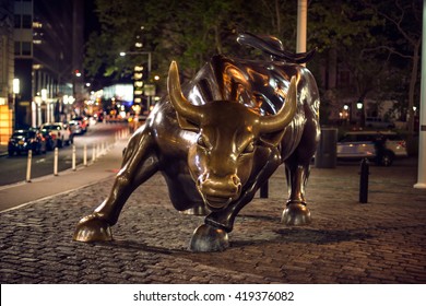 NEW YORK CITY - May 9: Wall Street Charging Bull At The Night. New York City Stock Exchange At May 9, 2016 In New York, NY.