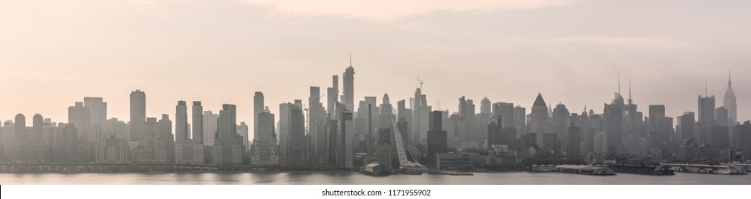 New York City Midtown Manhattan Skyline Panorama View From Boulevard East Old Glory Park Over Hudson River On A Misty Morning.