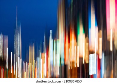 New York City night scene at Chelsea Pier with abstract blurred light streaks from the skyline buildings - Powered by Shutterstock