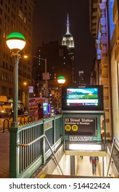 NEW YORK CITY - NOV 8: Entrance To Subway Station On November 28, 2014 With Empire State Building In Background.  There Are 469 Stations In Operation In NYC.