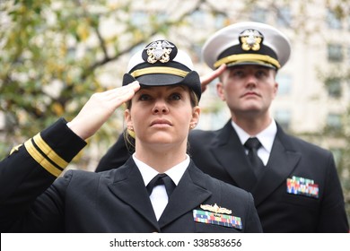 NEW YORK CITY - NOVEMBER 11 2015: New York City's Veterans Day parade was led by the US navy as this year's featured service. US navy in dress uniform salute during rendition of Star Spangled Banner