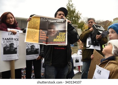 NEW YORK CITY - NOVEMBER 22 2015: Stop Mass Incarcerations Network Sponsored A Children's March On The Anniversary Of Tamir Rice's Death By Police. Noche Diaz Of RevCom Holds Tamir Rice Article