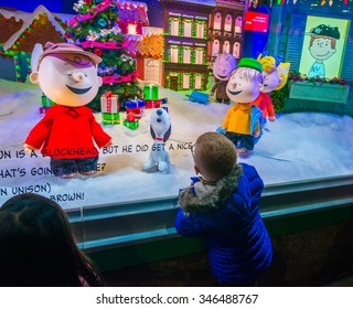 NEW YORK CITY - NOVEMBER 26: Little Boy Watching Holiday Window Display At Macy's Store On November 26, 2015, Thanksgiving Day, In New York. A Fairytale About Children Celebrating Christmas. 