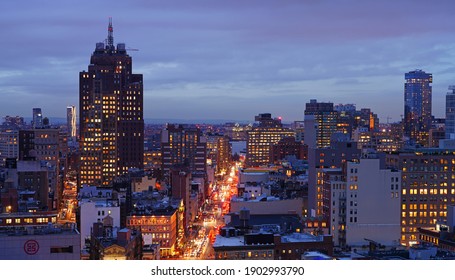 NEW YORK CITY, NY -1 FEB 2020- Night view of the Canal Street, Soho and Tribeca cityscape skyline seen from Chinatown in Manhattan, New York City, United States.