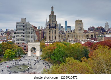 NEW YORK CITY, NY -9 NOV 2018- Autumn view of the Washington Square Arch with foliage, located in the Greenwich Village neighborhood of Lower Manhattan near the campus of New York University (NYU).