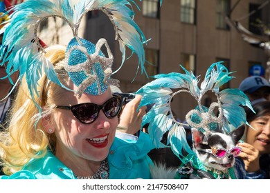 New York City, NY- April 17, 2022: A Woman And Her Dog, In Elaborate Matching Costumes,  Appear In The Annual Easter Bonnet Parade On Fifth Avenue.