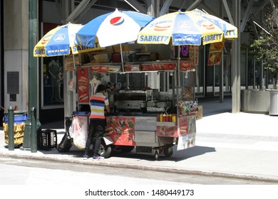 New York City, NY – August 15, 2019. A Middle Eastern Food Vendor On 33rd Street Outside Of Madison Square Garden On A Hot Summer Day.