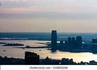 NEW YORK CITY, NY - DEC 22, 2009: View Of Goldman Sachs Skyscraper During Sunset Seen From Manhattan