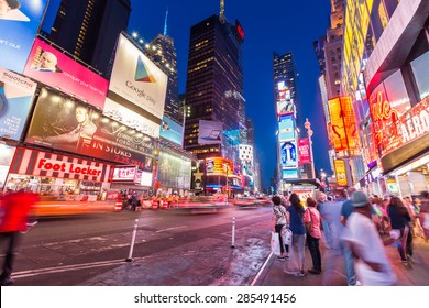 NEW YORK CITY, NY - JUN 24: Times Square and Broadway Theaters at night is one of  the most tourist visited location in New York City on June 24, 2014 - Shutterstock ID 285491456