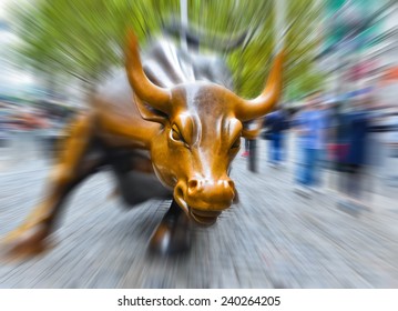 NEW YORK CITY, NY - OCT 11: Charging Bull Sculpture On October 11, 2013 In New York City. The Sculpture Is Both A Popular Tourist Destination And A Symbol Of The New York Stock Exchange.