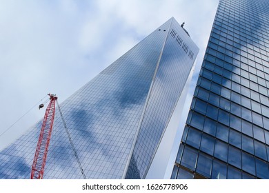 New York City, NY / United States of America - January 6 2020: blue glass skyscraper of the modern One World Trade Center on Manhattan Island, downtown area.