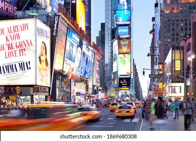 New York City, NY, United States - Traffic, people and advertising signs at Times Square.