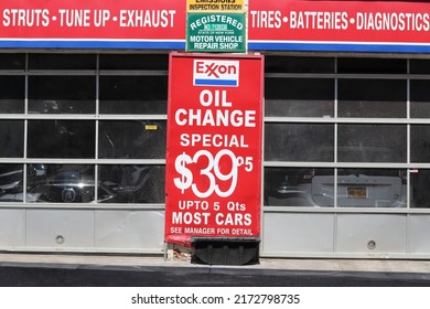 New York City, NY United States - June 26, 2022: An Exxon sign in Washington Heights, Manhattan advertises an oil change special for $39.95.