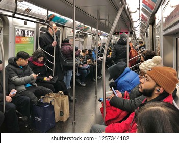 New York City, NY/ USA- 12-12-18: NYC Subway Train Commuter People Riding Subway Car To Work Crowded City Train MTA