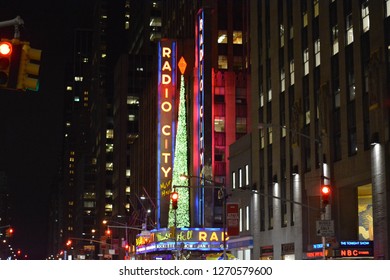 New York City, NY, USA - 121217:
A Colourful, Vibrant View Of The Times Square / Broadway Region Of New York City At Night. Bright Bill Boards Light Dark, Busy Streets