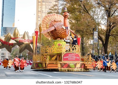 New York City, NY, USA - November 22, 2018:  Turkey float in NYC with pilgrim marchers and spectators near the start of The 92th annual Macy's Thanksgiving Day Parade