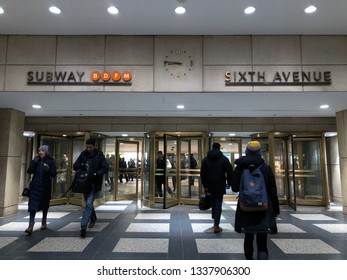 New York City, NY/ USA: 3-12-19- New York Subway Sign People Commuting To Work NYC Subway Train Entrance