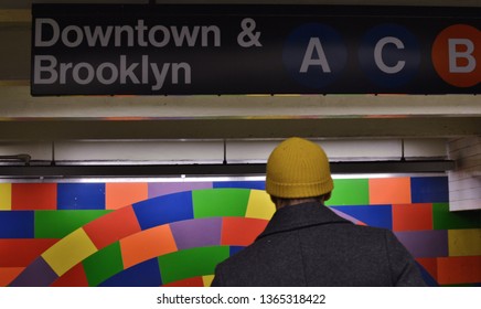 New York City, NY/ USA: 4-05-19- People In NYC Subway Station Brooklyn Downtown Billboard Sign Modern Art Tile Wall